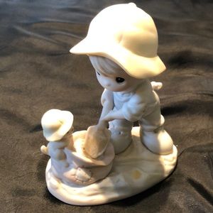 Precious Moments~~~NOTHING CAN DAMPEN THE SPIRIT OF CARING.    PRICE REDUCED